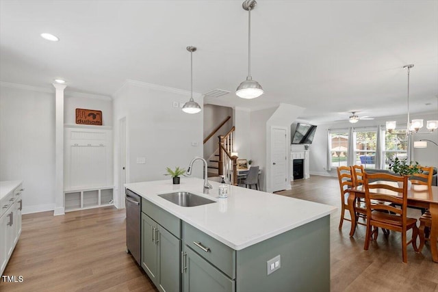 1304 Castlebay Rd, Durham, NC 27703 - kitchen with a fireplace, dishwasher, ceiling fan, open floor plan, and light countertops
