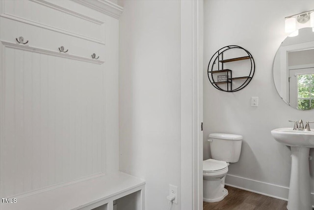 1304 Castlebay Rd, Durham, NC 27703 - half bathroom with toilet and wood finished floors