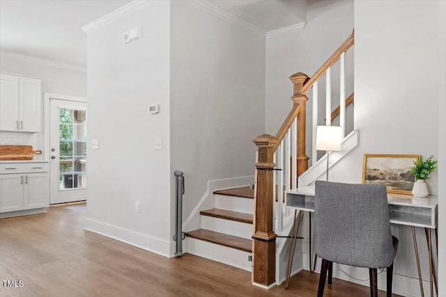 1304 Castlebay Rd, Durham, NC 27703 - staircase with wood finished floors and crown molding