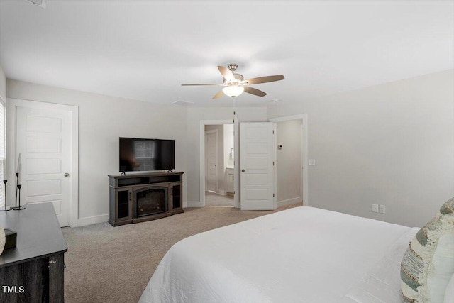 1304 Castlebay Rd, Durham, NC 27703 - carpeted bedroom with a ceiling fan and a fireplace