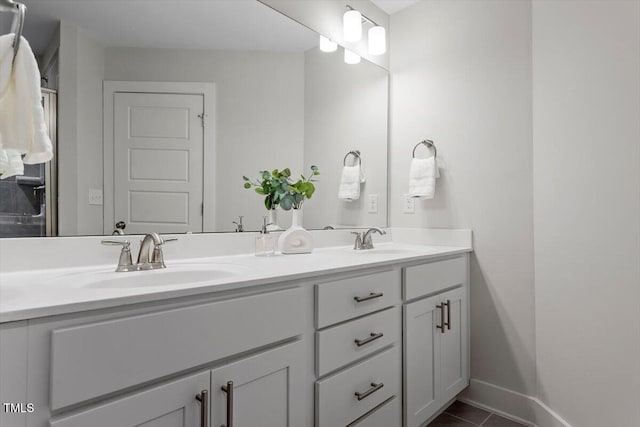 1304 Castlebay Rd, Durham, NC 27703 - bathroom featuring double vanity and tile patterned flooring