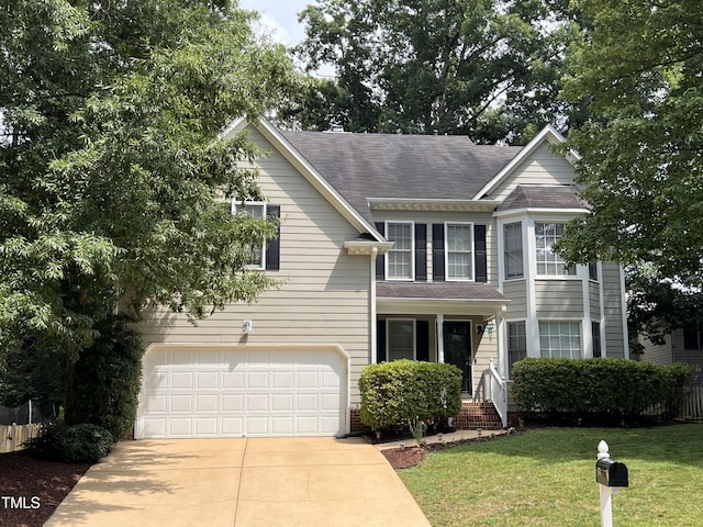 9504 Anson Grove Ln, Raleigh, NC 27615 - traditional home featuring driveway, a garage, and roof with shingles