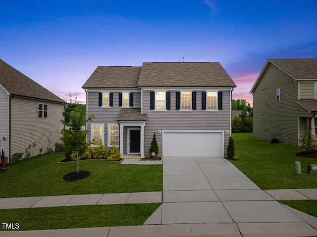 120 Misty Grove Trl, Franklinton, NC 27525 - colonial inspired home featuring a garage, concrete driveway, a yard, and a shingled roof