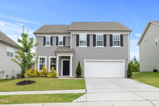 120 Misty Grove Trl, Franklinton, NC 27525 - view of front of house featuring a garage, a front yard, driveway, and a shingled roof
