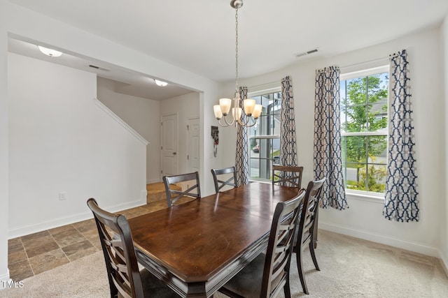 120 Misty Grove Trl, Franklinton, NC 27525 - dining space with a chandelier and stone finish floors