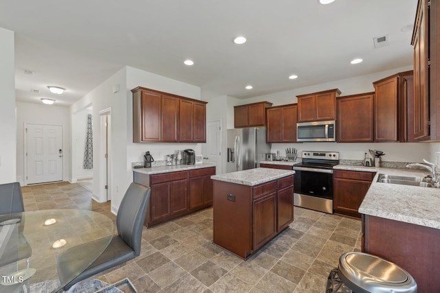 120 Misty Grove Trl, Franklinton, NC 27525 - kitchen with appliances with stainless steel finishes, a center island, and recessed lighting