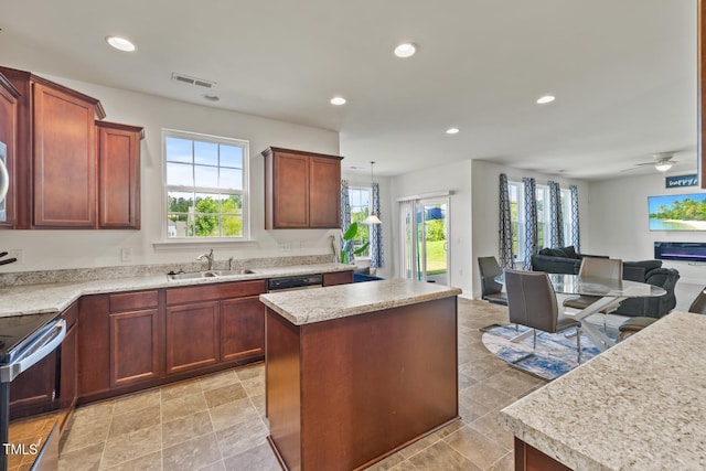 120 Misty Grove Trl, Franklinton, NC 27525 - kitchen featuring a center island, light countertops, recessed lighting, open floor plan, and electric range oven