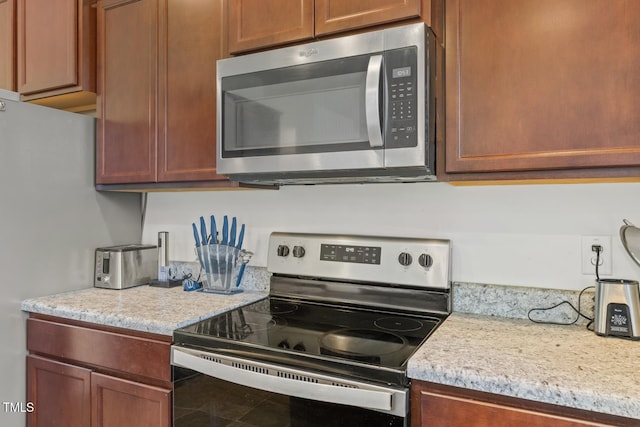 120 Misty Grove Trl, Franklinton, NC 27525 - kitchen featuring stainless steel appliances and light stone countertops