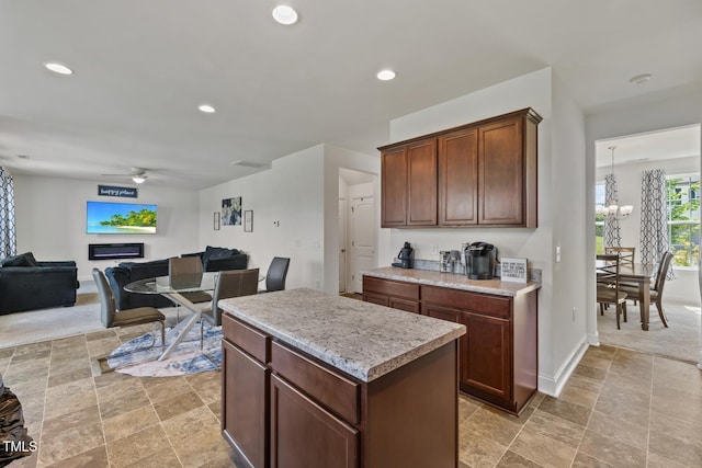 120 Misty Grove Trl, Franklinton, NC 27525 - kitchen with ceiling fan, a chandelier, light countertops, recessed lighting, and a kitchen island