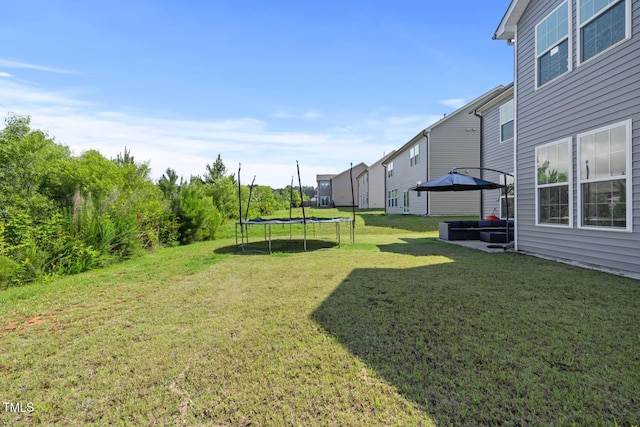 120 Misty Grove Trl, Franklinton, NC 27525 - view of grassy yard with a trampoline and outdoor lounge area