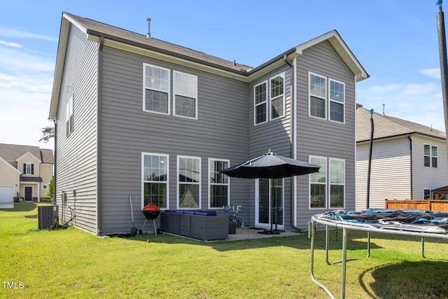 120 Misty Grove Trl, Franklinton, NC 27525 - back of property with a yard, a trampoline, and an outdoor hangout area