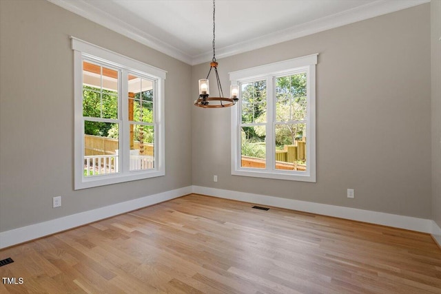 3934 Old Chapel Hill Rd, Durham, NC 27707 - unfurnished room featuring ornamental molding, a chandelier, and wood finished floors