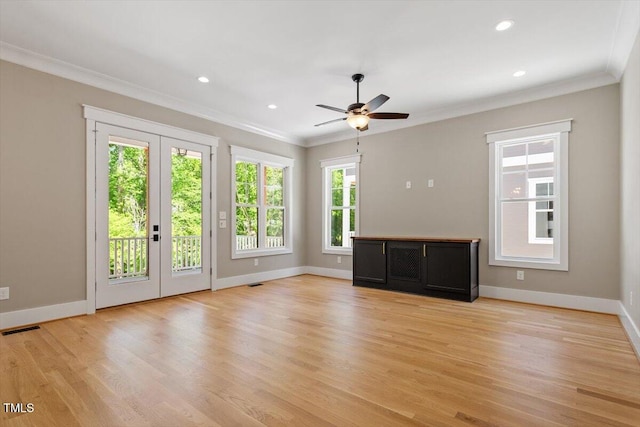 3934 Old Chapel Hill Rd, Durham, NC 27707 - unfurnished living room featuring ornamental molding, plenty of natural light, french doors, ceiling fan, and light wood-style flooring