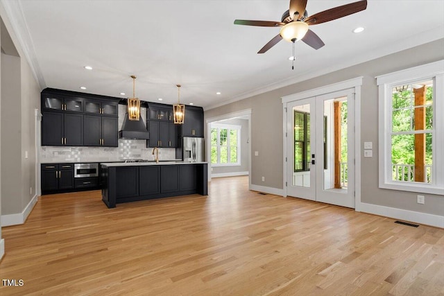 3934 Old Chapel Hill Rd, Durham, NC 27707 - kitchen featuring custom exhaust hood, stainless steel appliances, french doors, decorative backsplash, and light countertops