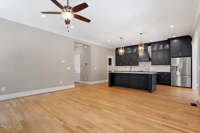 3934 Old Chapel Hill Rd, Durham, NC 27707 - kitchen with stainless steel fridge, custom exhaust hood, ceiling fan, tasteful backsplash, and light countertops
