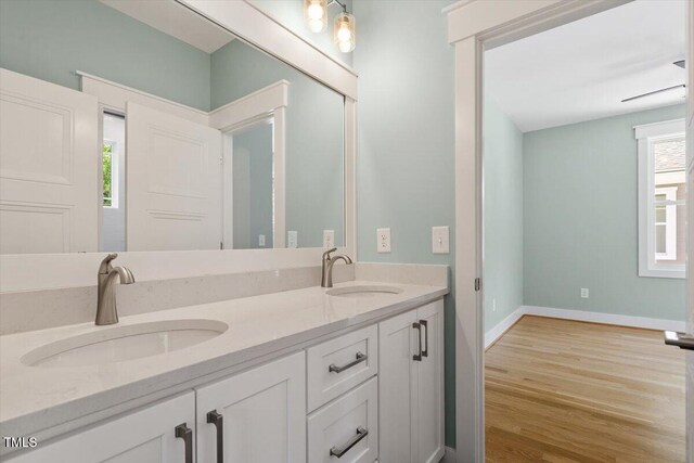 3934 Old Chapel Hill Rd, Durham, NC 27707 - bathroom with double vanity and wood finished floors
