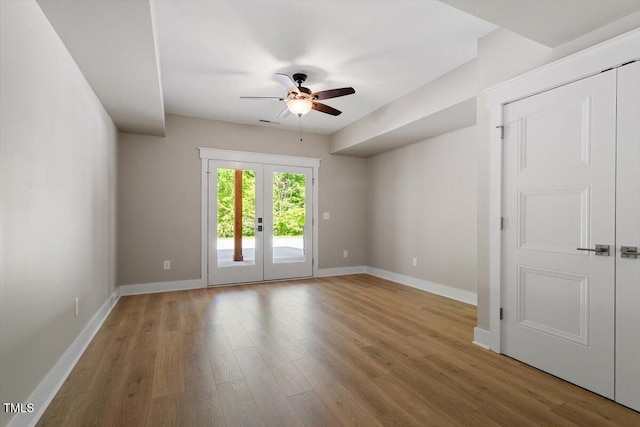 3934 Old Chapel Hill Rd, Durham, NC 27707 - empty room with ceiling fan, wood finished floors, and french doors