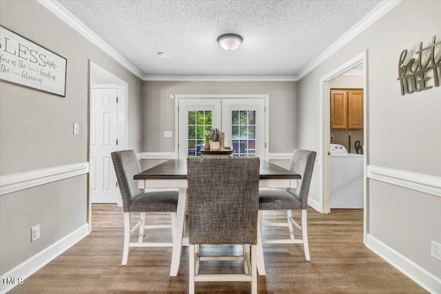 204 Paul Pl, Goldsboro, NC 27534 - dining room featuring french doors, wood finished floors, a textured ceiling, and ornamental molding