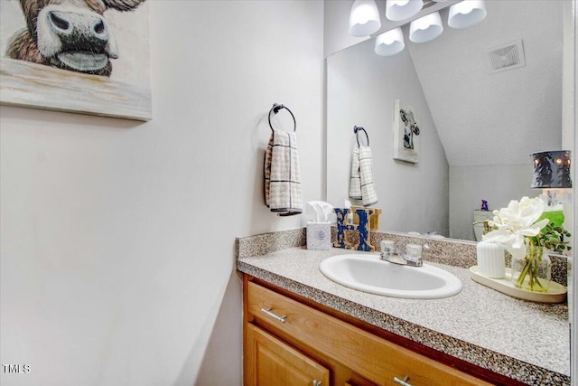 204 Paul Pl, Goldsboro, NC 27534 - bathroom with lofted ceiling and vanity