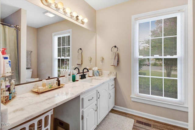 204 Paul Pl, Goldsboro, NC 27534 - bathroom featuring double vanity and wood finished floors