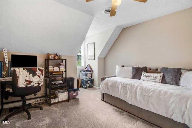 204 Paul Pl, Goldsboro, NC 27534 - bedroom with carpet floors, vaulted ceiling, a ceiling fan, and a textured ceiling