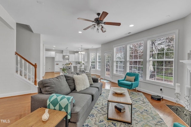 413 Westfalen Dr, Cary, NC 27519 - living room with stairs, light wood finished floors, recessed lighting, and ceiling fan