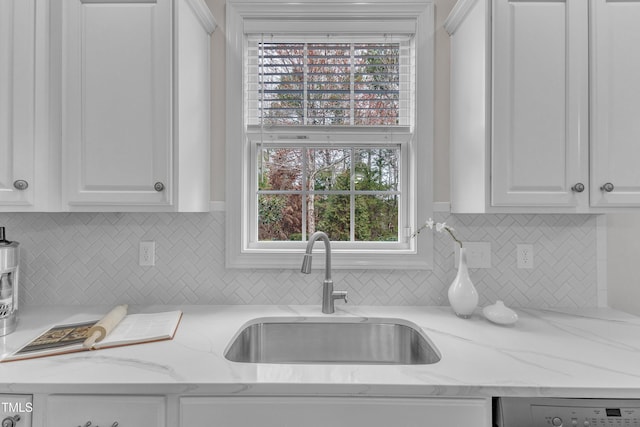 413 Westfalen Dr, Cary, NC 27519 - kitchen featuring white cabinetry, dishwasher, backsplash, and light stone countertops