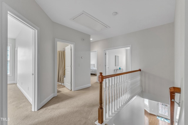 413 Westfalen Dr, Cary, NC 27519 - hallway featuring an upstairs landing, attic access, and light colored carpet