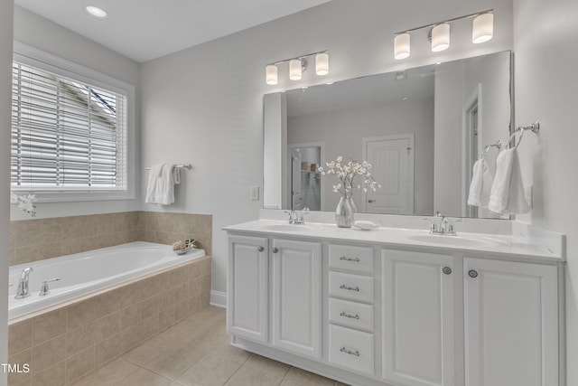 413 Westfalen Dr, Cary, NC 27519 - full bath featuring tile patterned floors, double vanity, and a bath