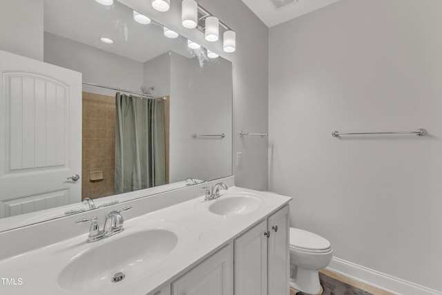 413 Westfalen Dr, Cary, NC 27519 - bathroom featuring double vanity and a shower with shower curtain