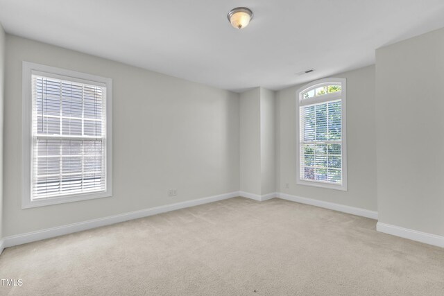 413 Westfalen Dr, Cary, NC 27519 - spare room featuring light colored carpet and baseboards