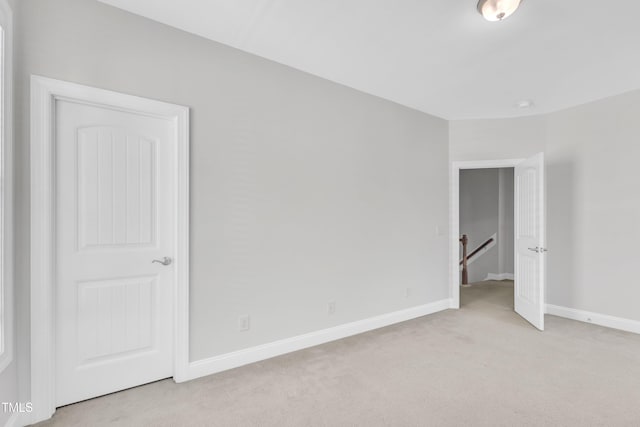 413 Westfalen Dr, Cary, NC 27519 - unfurnished bedroom featuring light carpet and baseboards