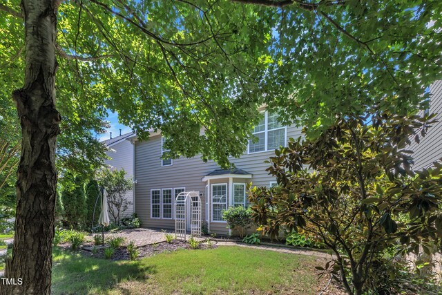 413 Westfalen Dr, Cary, NC 27519 - back of property featuring a lawn