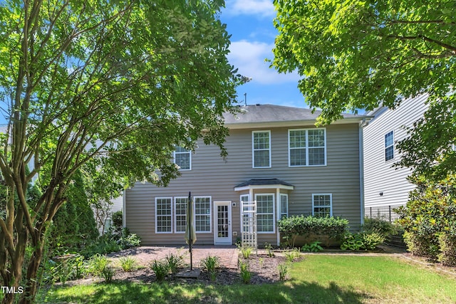413 Westfalen Dr, Cary, NC 27519 - rear view of house with a patio area and a lawn