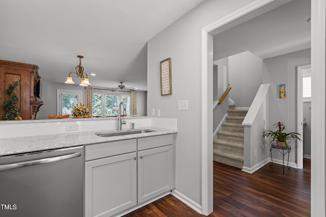 1815 Crystal Downs Ln, Raleigh, NC 27604 - kitchen with dishwasher, dark wood-type flooring, light stone counters, decorative light fixtures, and a chandelier