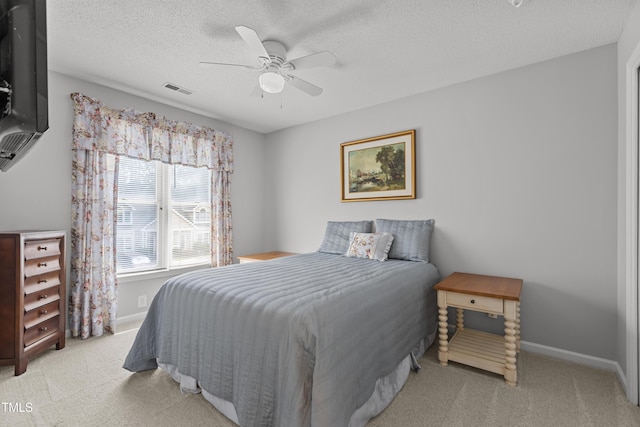 1815 Crystal Downs Ln, Raleigh, NC 27604 - bedroom featuring light carpet, a textured ceiling, and ceiling fan