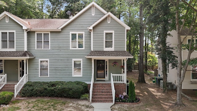1815 Crystal Downs Ln, Raleigh, NC 27604 - view of front facade featuring roof with shingles and covered porch