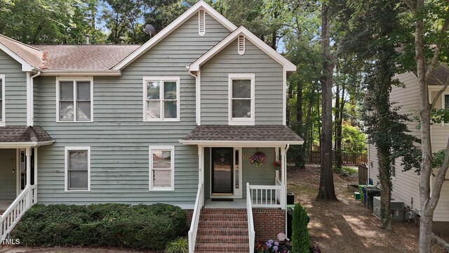 1815 Crystal Downs Ln, Raleigh, NC 27604 - view of front facade featuring a shingled roof and covered porch