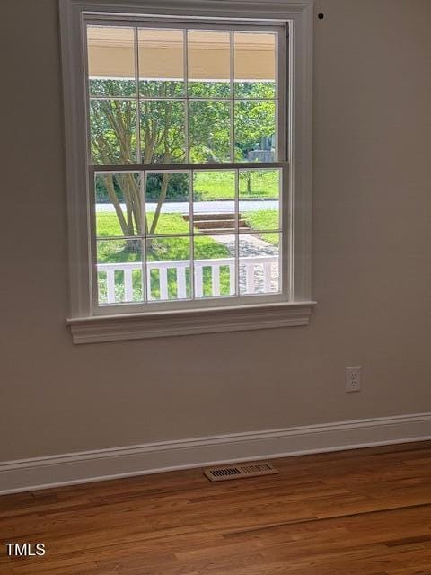 403 Rodwell St, Warrenton, NC 27589 - unfurnished room with wood finished floors and healthy amount of natural light