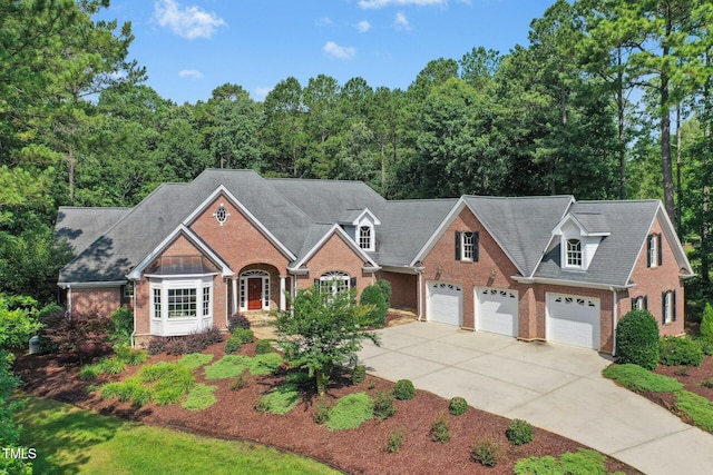 5204 Winter Holly Ct, Raleigh, NC 27606 - view of front of house featuring brick siding and driveway