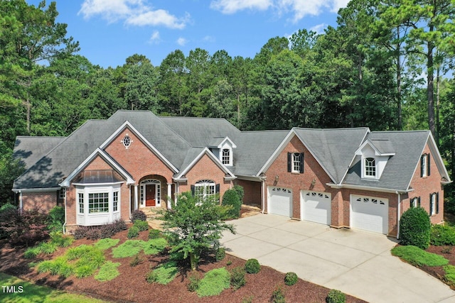 5204 Winter Holly Ct, Raleigh, NC 27606 - view of front of home with brick siding and driveway