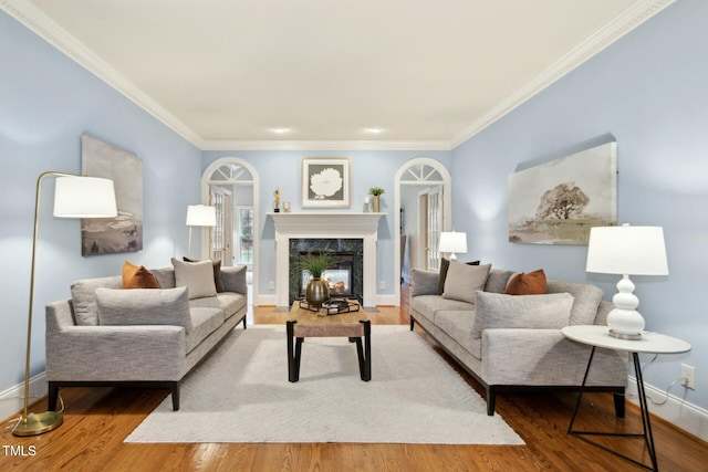 5204 Winter Holly Ct, Raleigh, NC 27606 - living room featuring crown molding, a fireplace, and wood finished floors