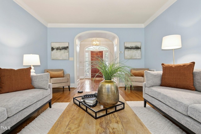 5204 Winter Holly Ct, Raleigh, NC 27606 - living area with arched walkways, crown molding, and wood finished floors