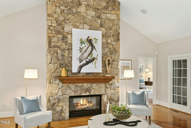 5204 Winter Holly Ct, Raleigh, NC 27606 - living room with wood finished floors, high vaulted ceiling, and a fireplace