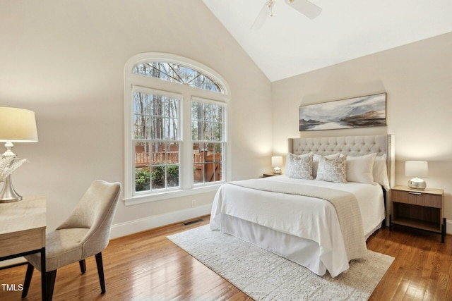 5204 Winter Holly Ct, Raleigh, NC 27606 - bedroom with multiple windows, wood finished floors, high vaulted ceiling, and a ceiling fan