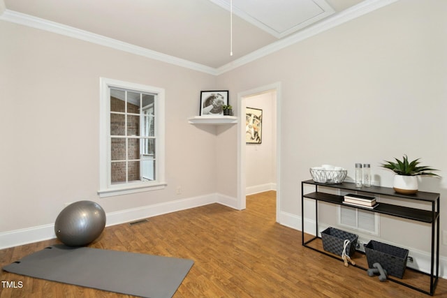 5204 Winter Holly Ct, Raleigh, NC 27606 - exercise area featuring crown molding, wood finished floors, and attic access