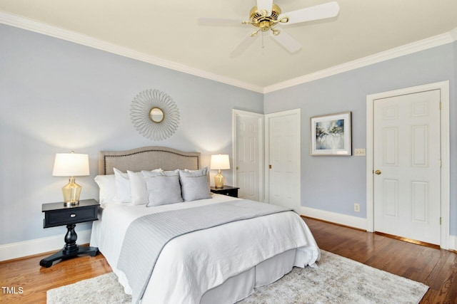5204 Winter Holly Ct, Raleigh, NC 27606 - bedroom with wood finished floors, crown molding, and a ceiling fan