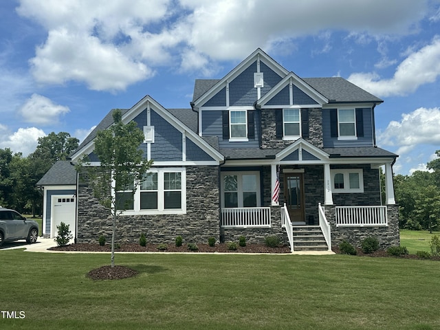 2812 Arrowsmith Dr, Fuquay Varina, NC 27526 - craftsman inspired home featuring stone siding, a porch, a front yard, an attached garage, and a shingled roof