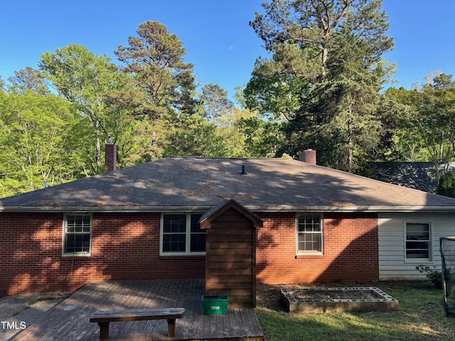 2705 Royster St, Raleigh, NC 27608 - back of house featuring a chimney, brick siding, and a shingled roof