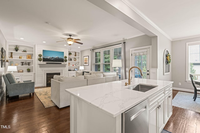 508 Morning Oaks Dr, Holly Springs, NC 27540 - kitchen with stainless steel dishwasher, dark wood-style floors, light stone countertops, ornamental molding, and a ceiling fan